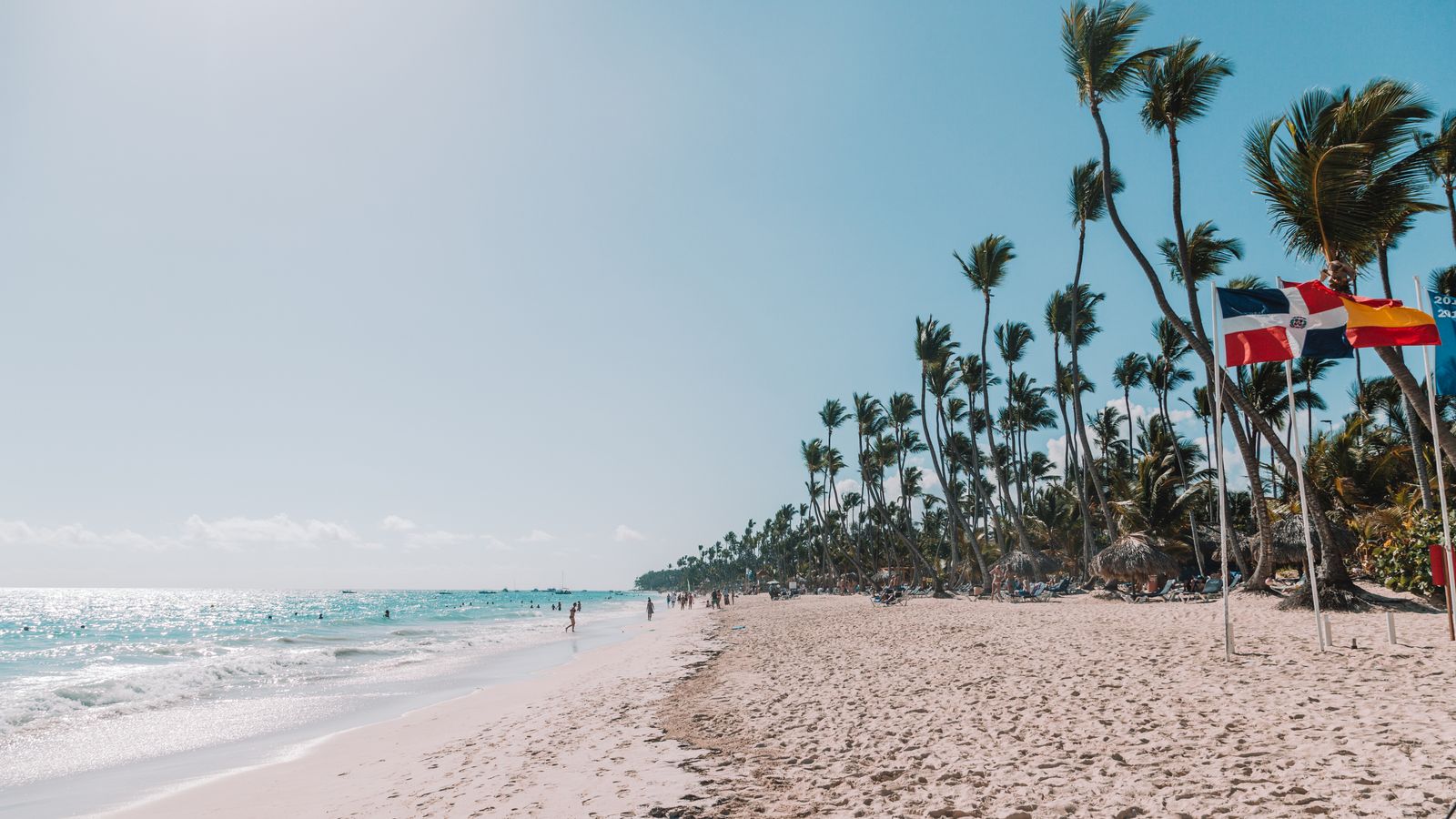 Punta Cana beach with the Dominican Republic flag
